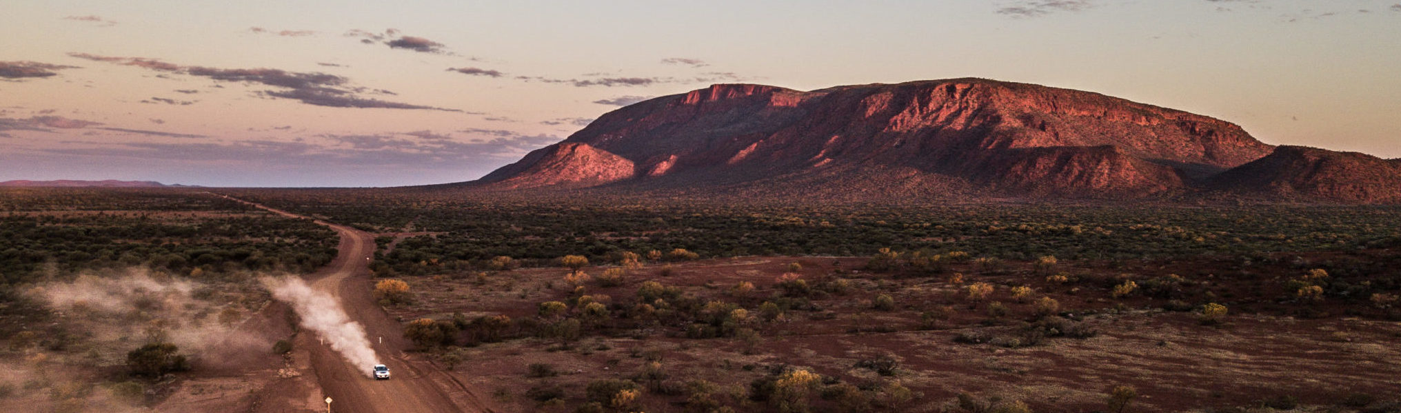 Car driving past Mt Augustus