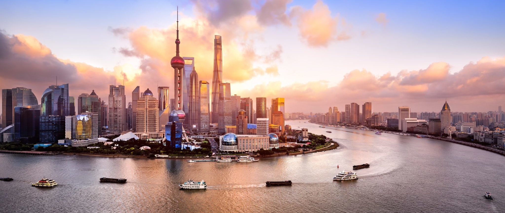 Boats floating along the Huangpu River, China.