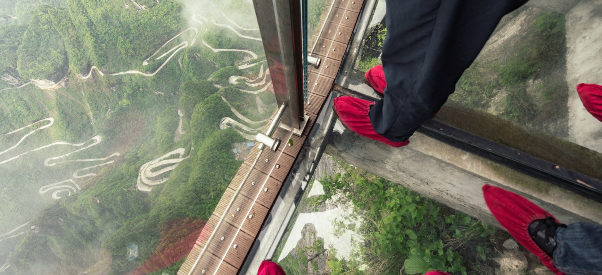 People on glass bridge at Tianmen mountain.