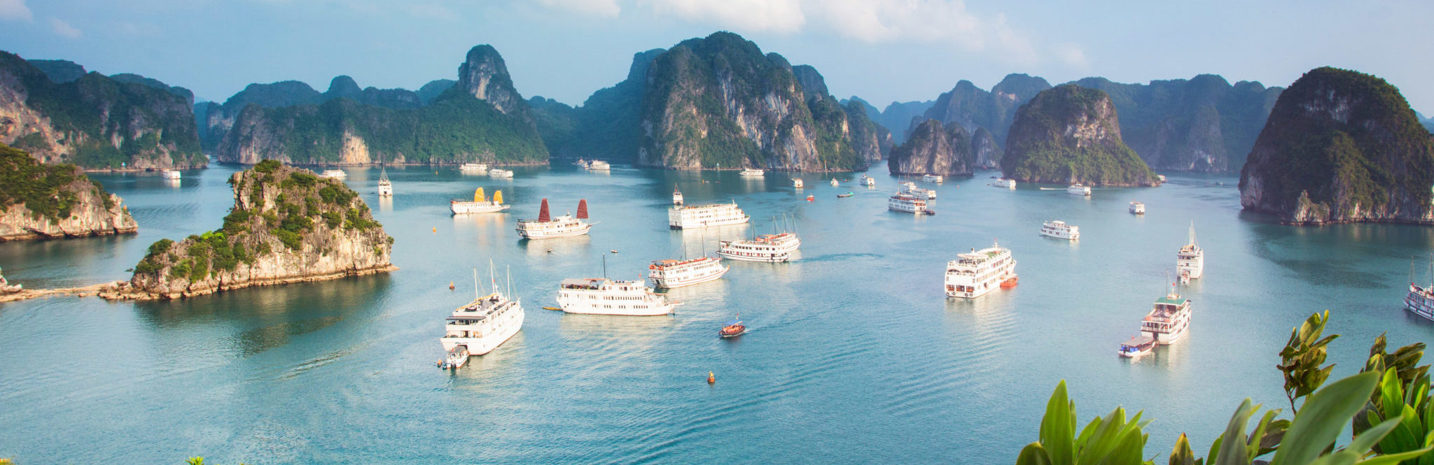 A landscape image of Ha Long Bay and junk boats.